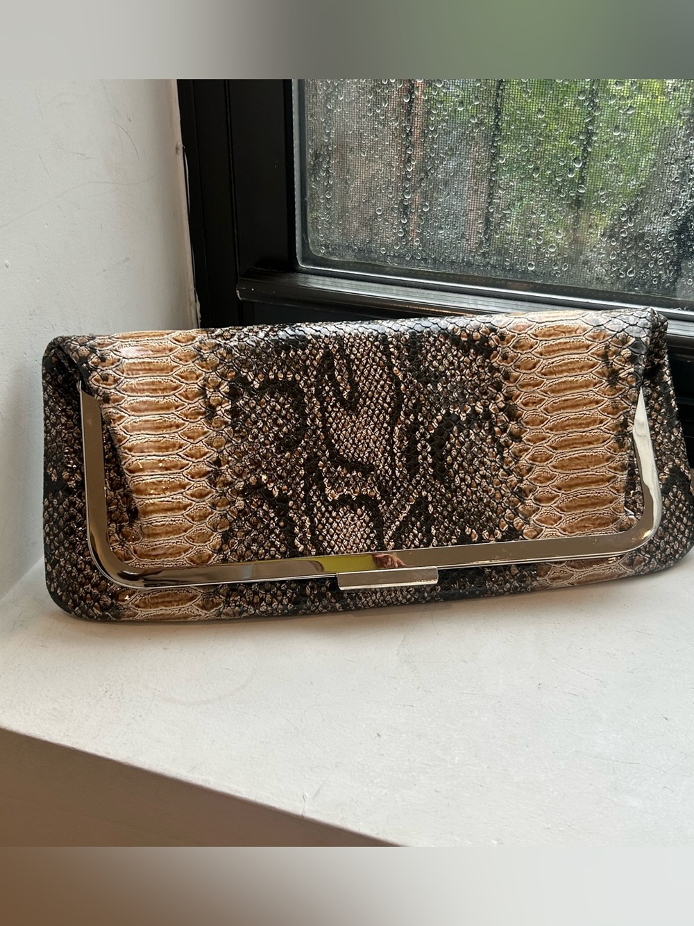 Snake-Embossed Clutch in Tan and Black with Metallic Trim